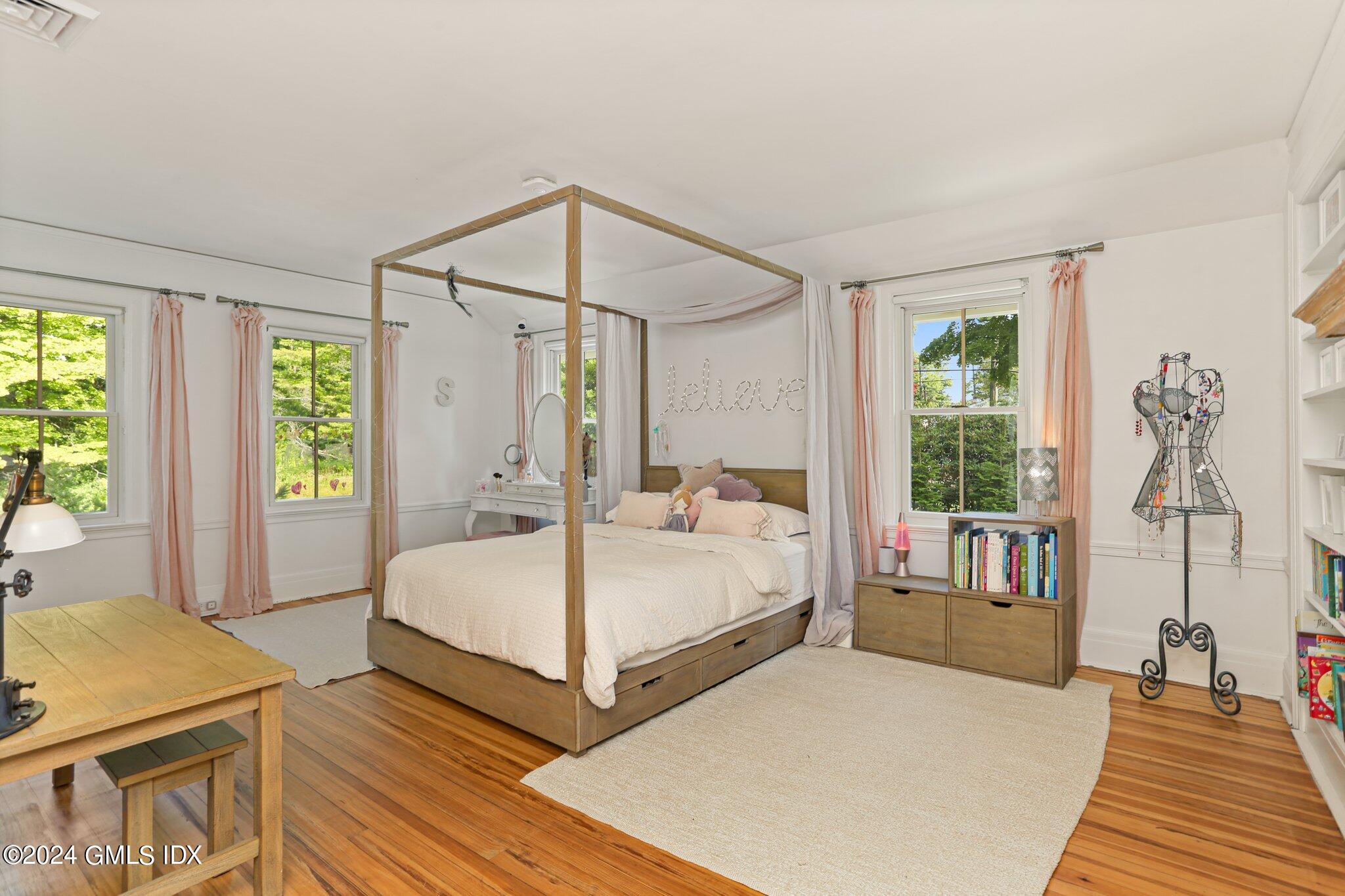 127 Dingletown Road Greenwich, CT 06830 - Photo 29 of 54 a room with two beds and a table