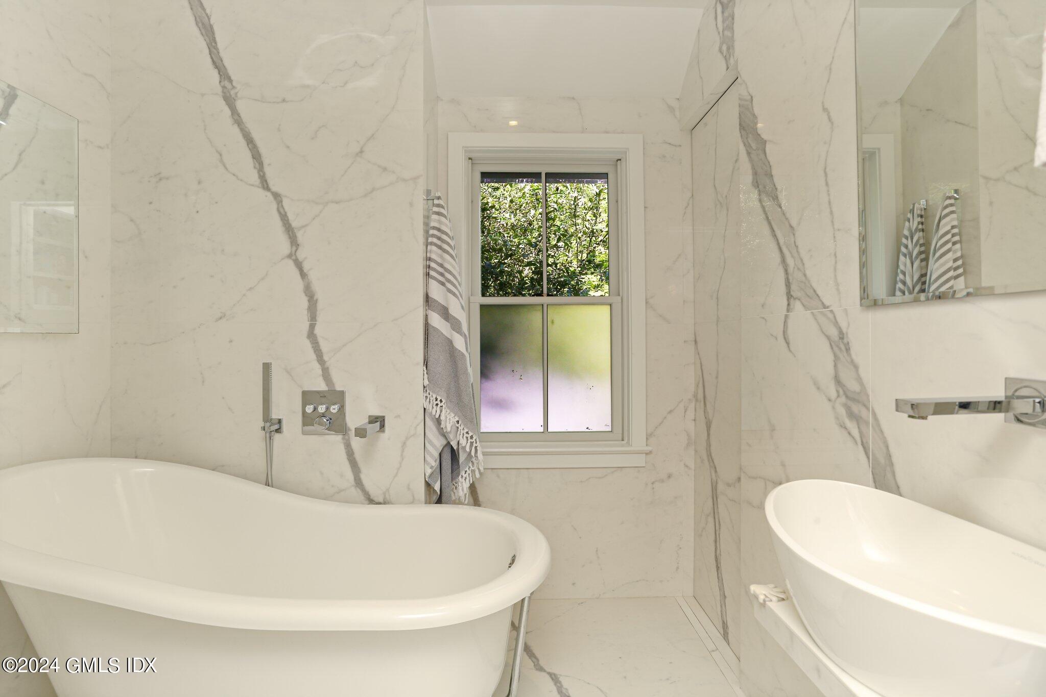 127 Dingletown Road Greenwich, CT 06830 - Photo 32 of 54 a white bath tub sitting next to a white toilet
