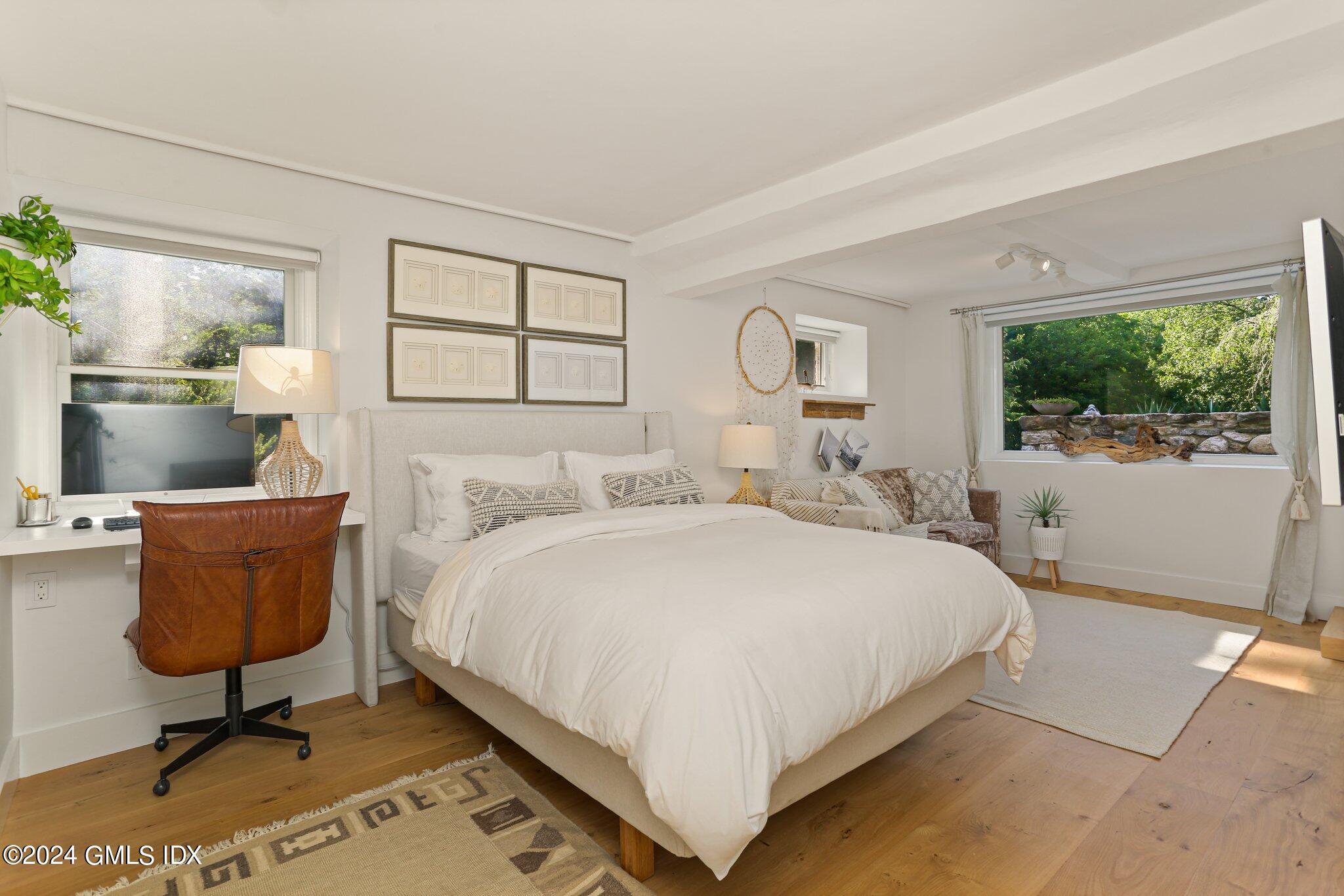 127 Dingletown Road Greenwich, CT 06830 - Photo 34 of 54 a bedroom with a bed a window and mirror