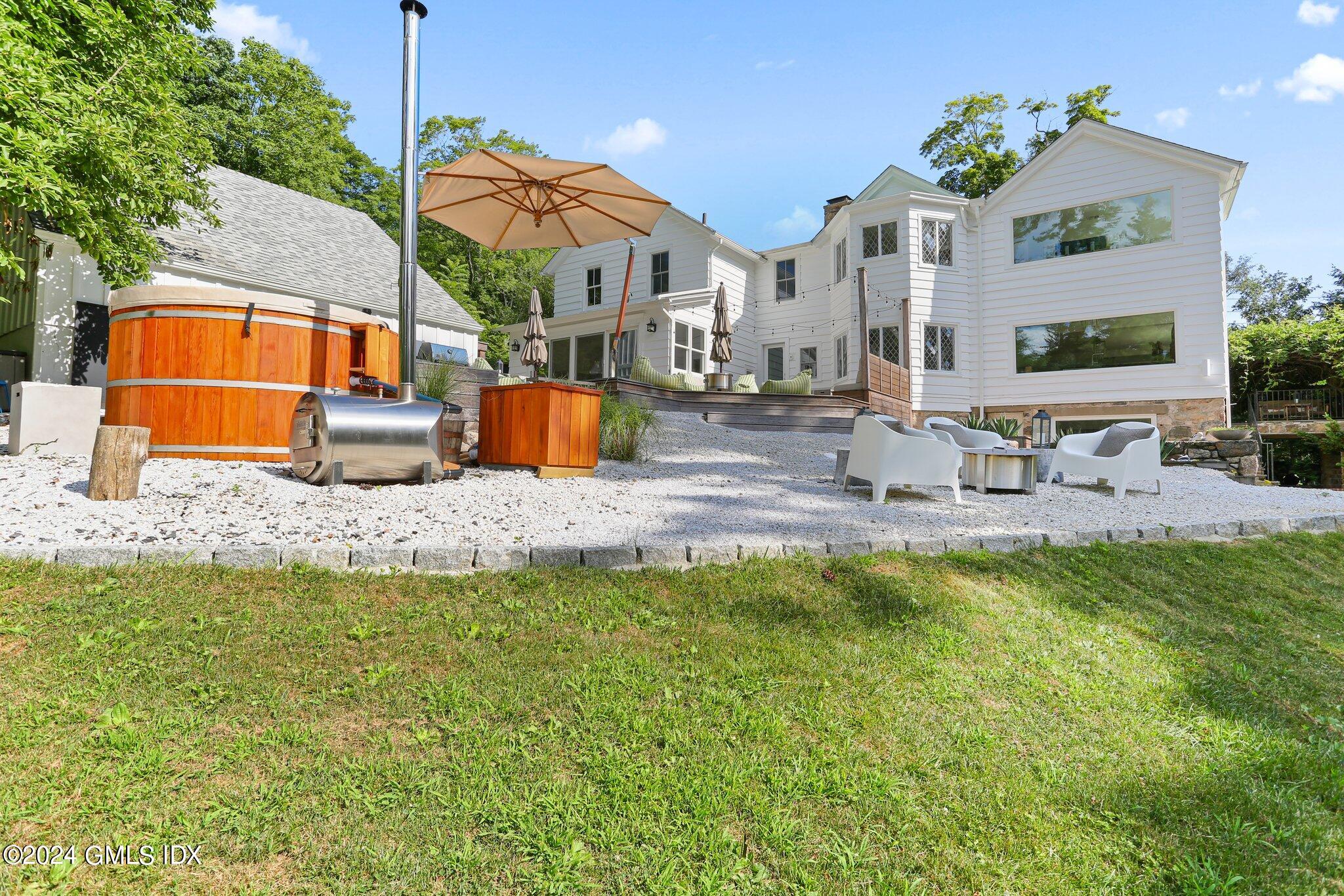 127 Dingletown Road Greenwich, CT 06830 - Photo 42 of 54 a view of a house with swimming pool