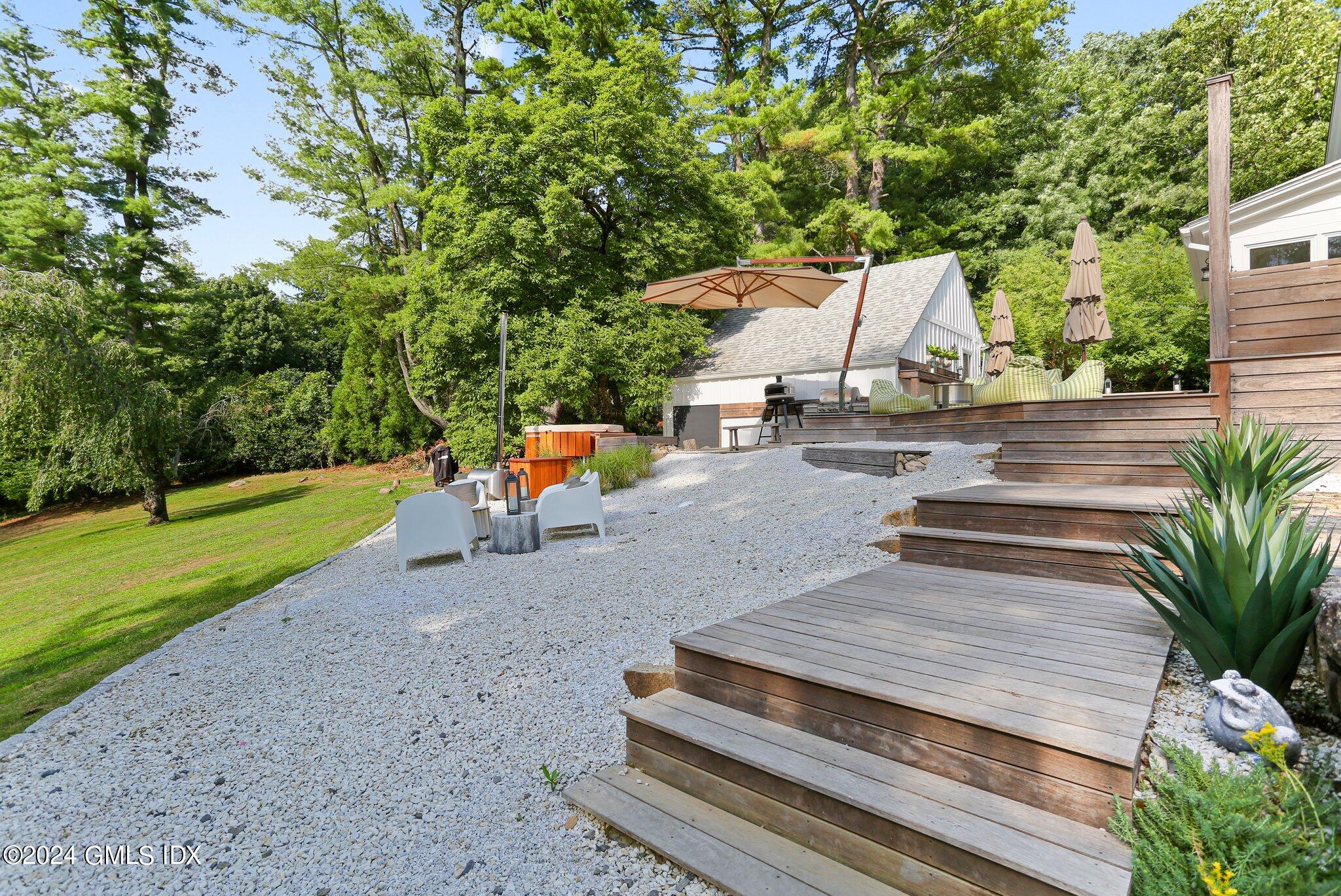 127 Dingletown Road Greenwich, CT 06830 - Photo 44 of 54 a view of a backyard with sitting area