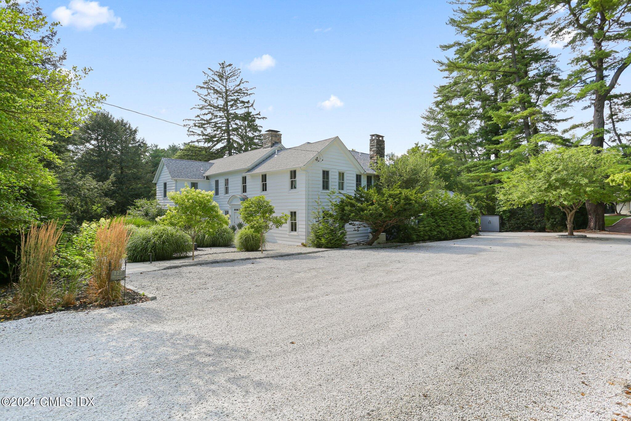 127 Dingletown Road Greenwich, CT 06830 - Photo 49 of 54 a view of a house with a street