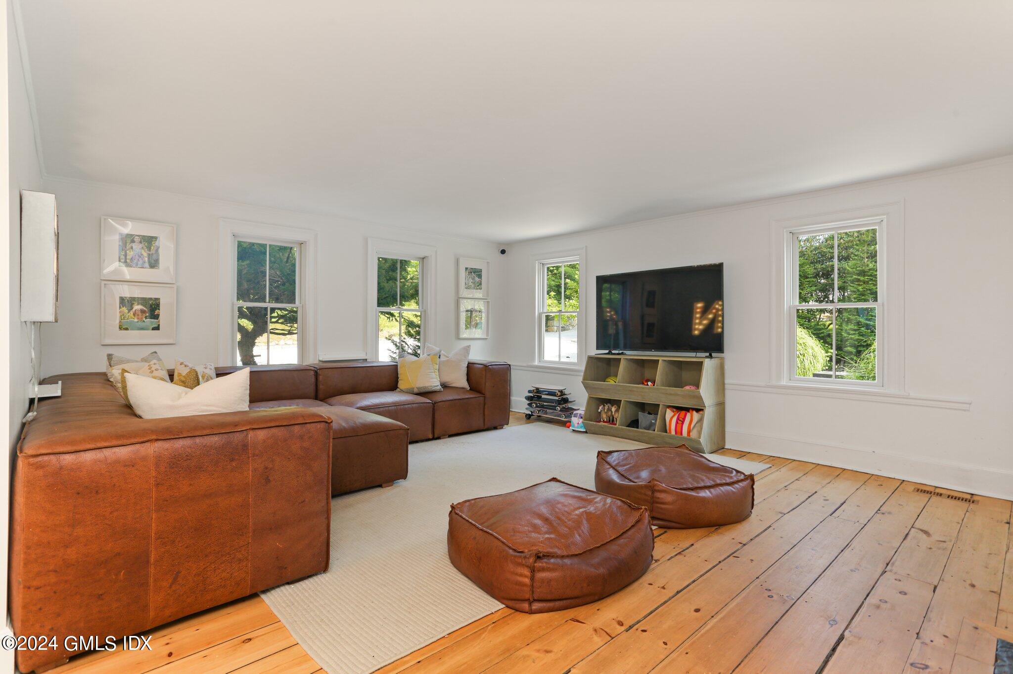 127 Dingletown Road Greenwich, CT 06830 - Photo 5 of 54 a living room with furniture and a flat screen tv