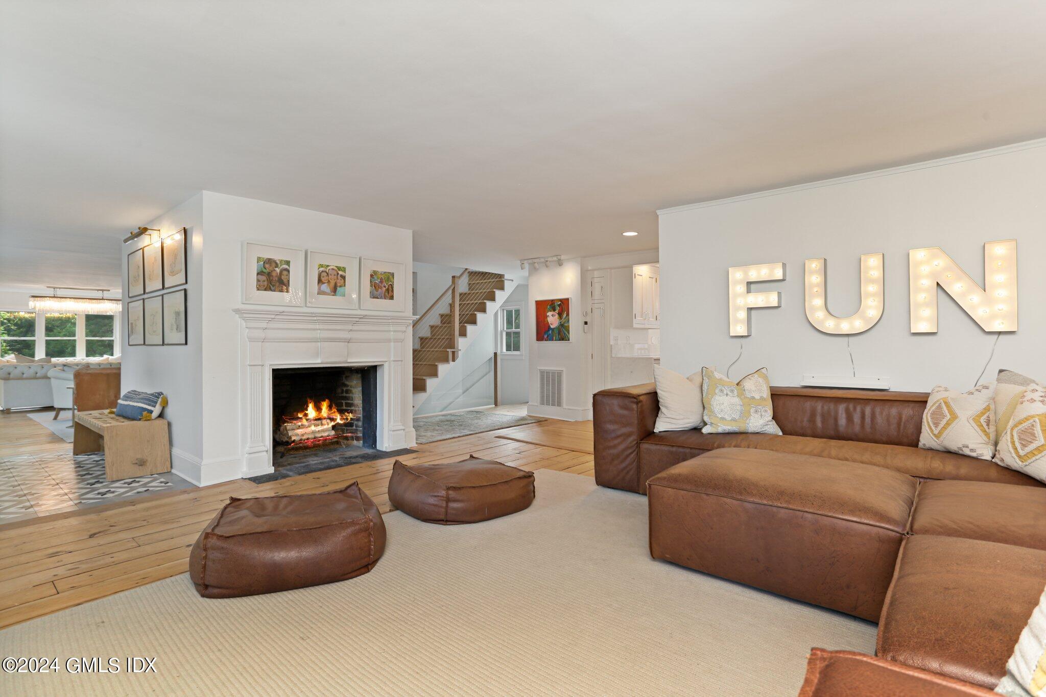 127 Dingletown Road Greenwich, CT 06830 - Photo 6 of 54 a living room with furniture and a fireplace