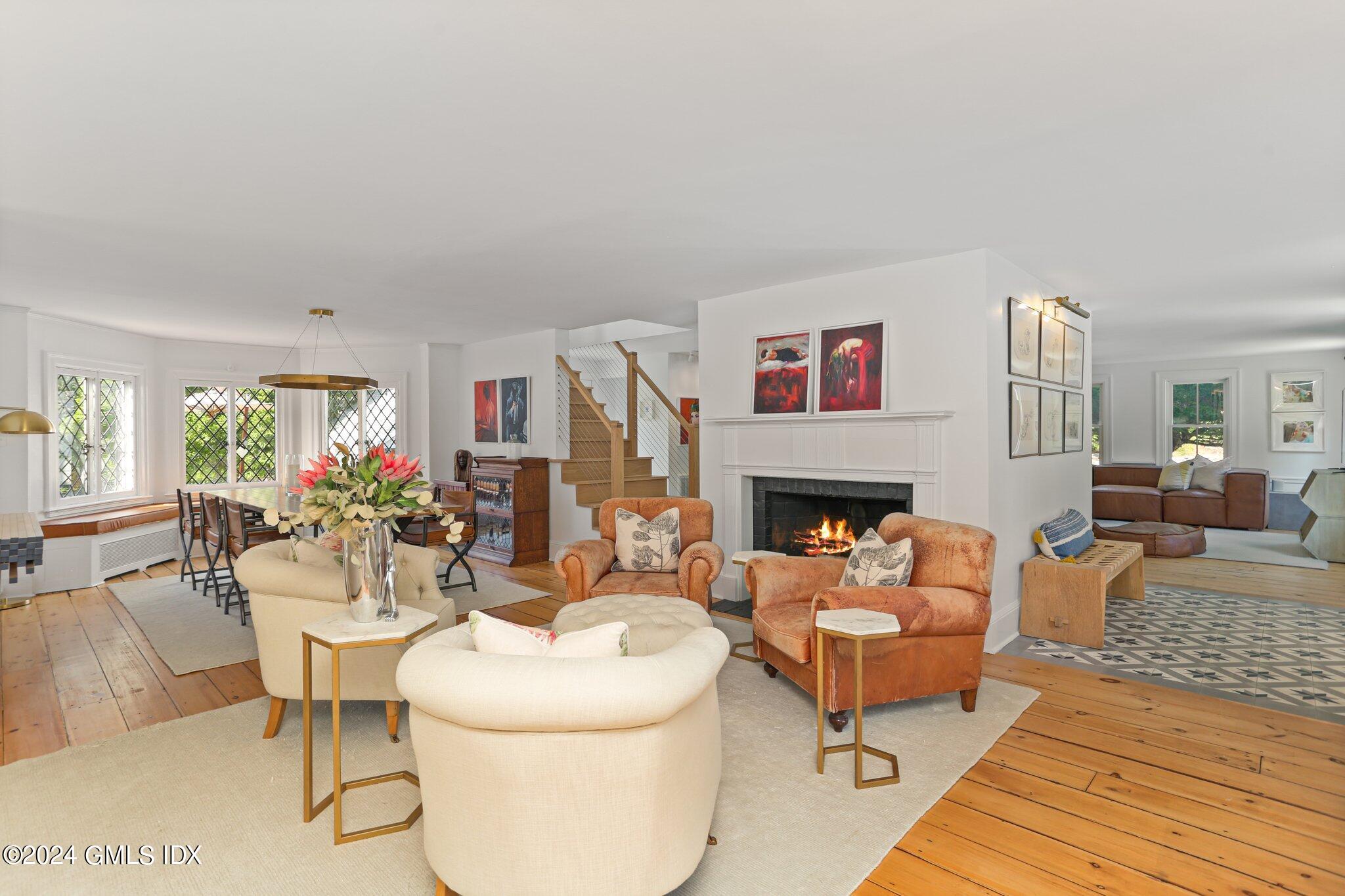 127 Dingletown Road Greenwich, CT 06830 - Photo 7 of 54 a living room with furniture a fireplace and a table