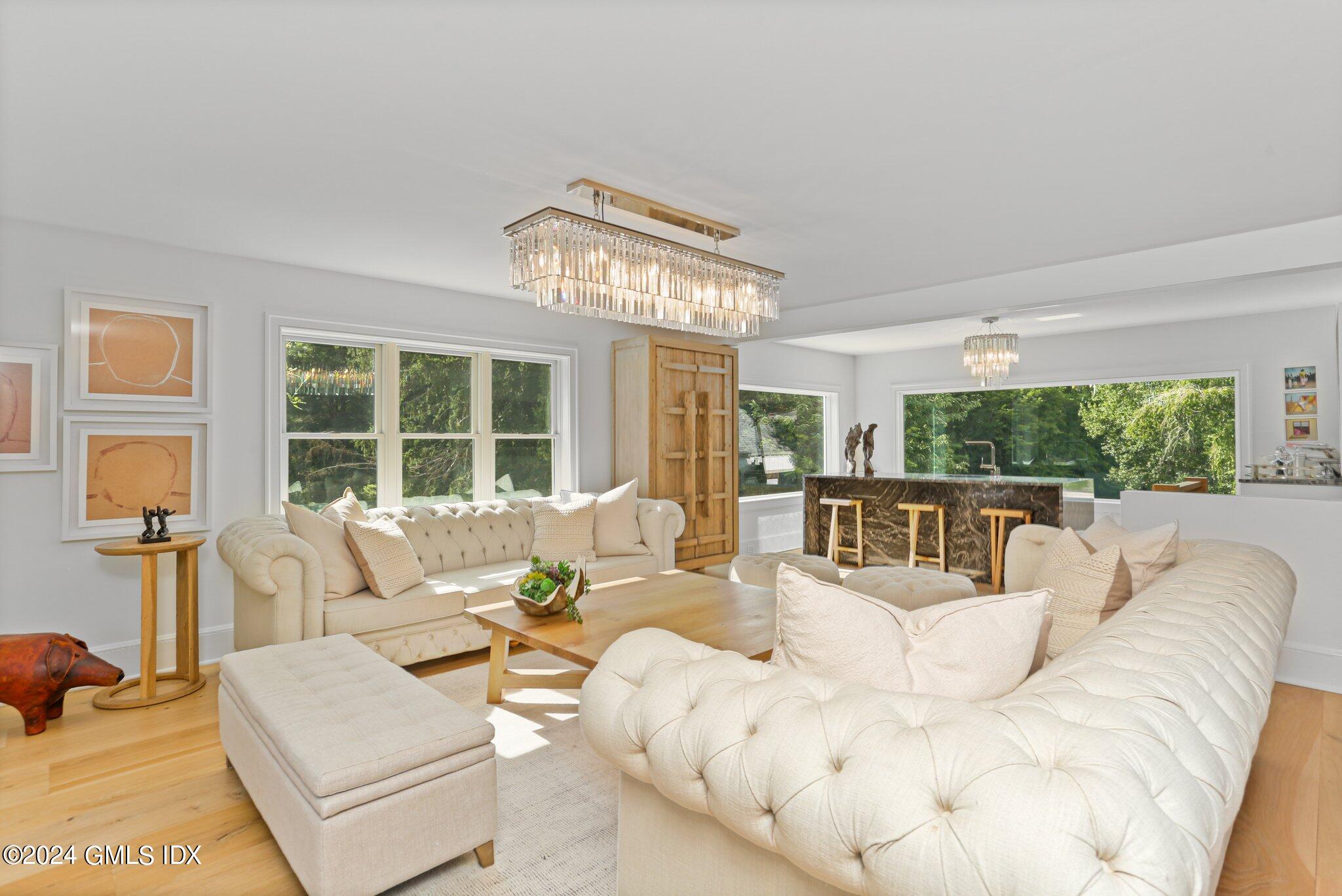 127 Dingletown Road Greenwich, CT 06830 - Photo 8 of 54 a living room with furniture and a large window