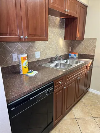a kitchen with a sink and cabinets