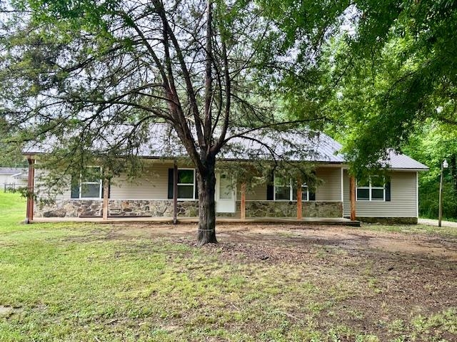 15 Brookwood Loop Adamsville, TN 38310 - Photo 13 of 21 front view of a house with a yard