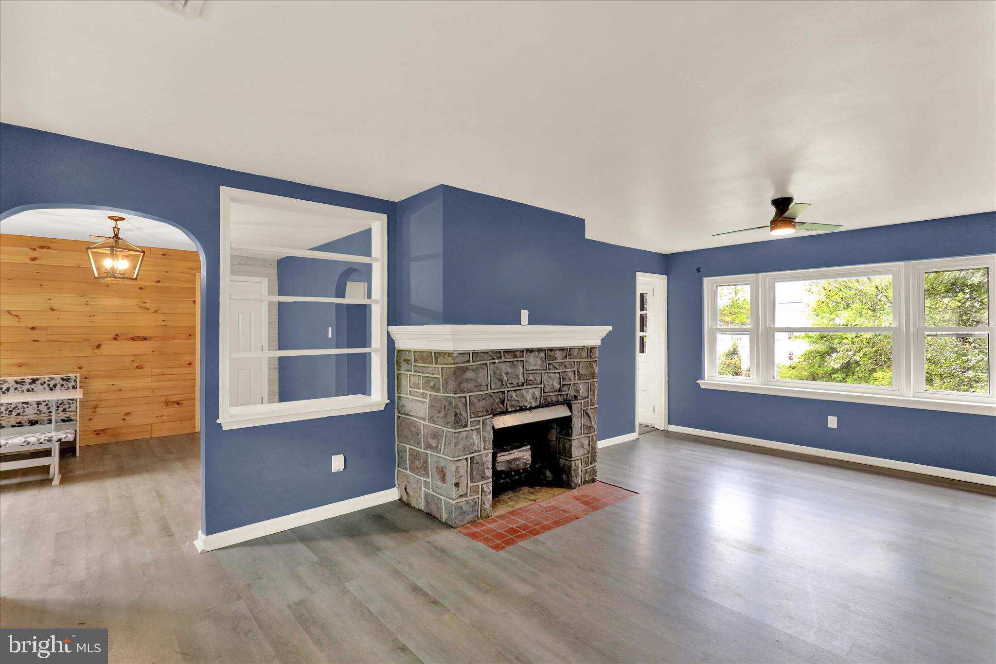 434 East Moyer Road Pottstown, PA 19464 - Photo 6 of 38 an empty room with furniture and a fireplace