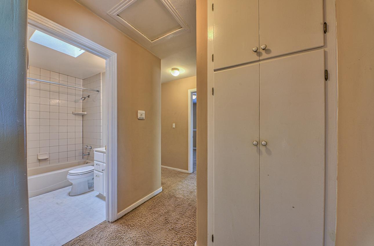 7 Grove Street Salinas, CA 93901 - Photo 14 of 33 a bathroom with a glass shower door