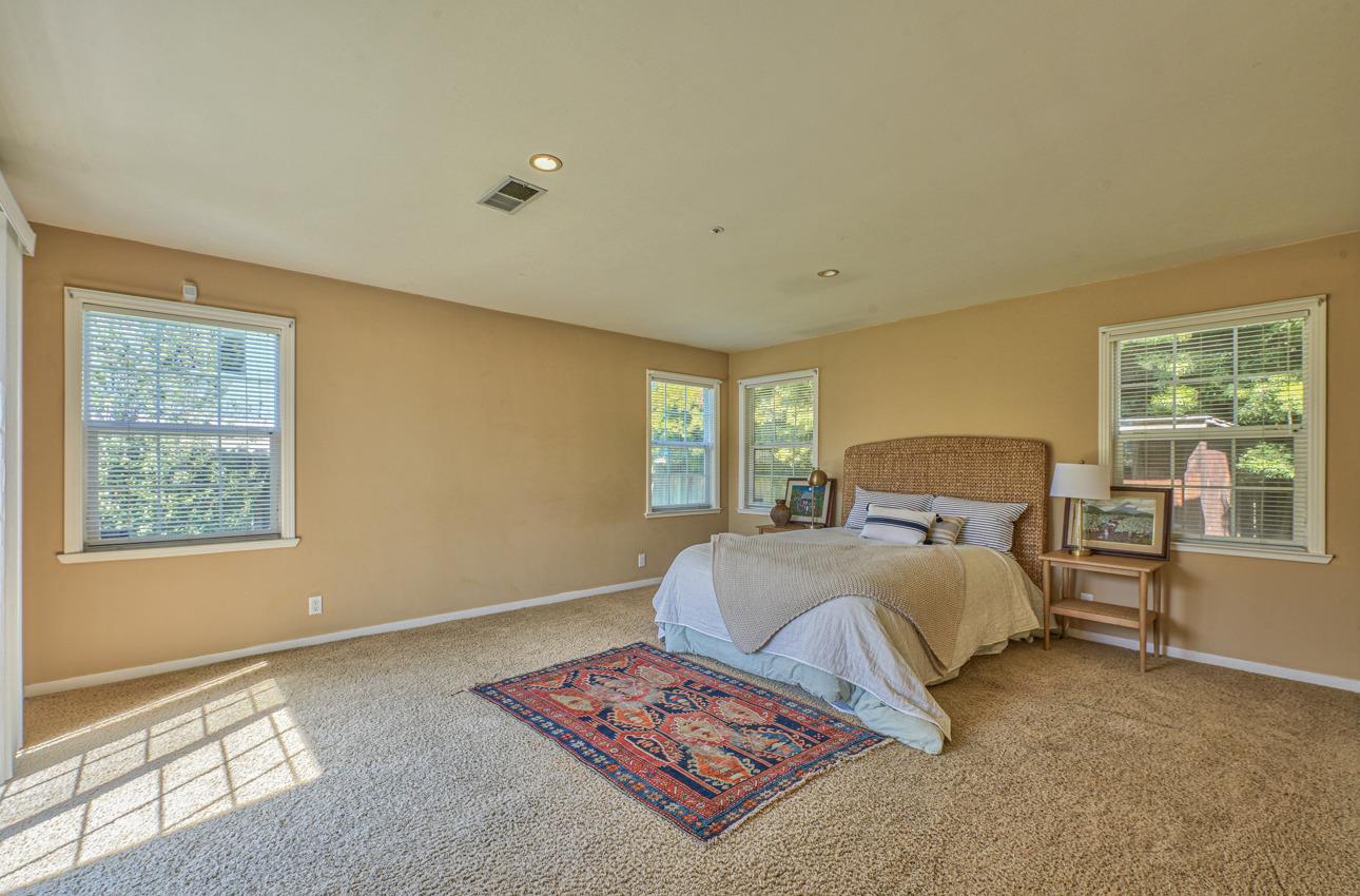7 Grove Street Salinas, CA 93901 - Photo 16 of 33 a bedroom with a bed and wooden floor
