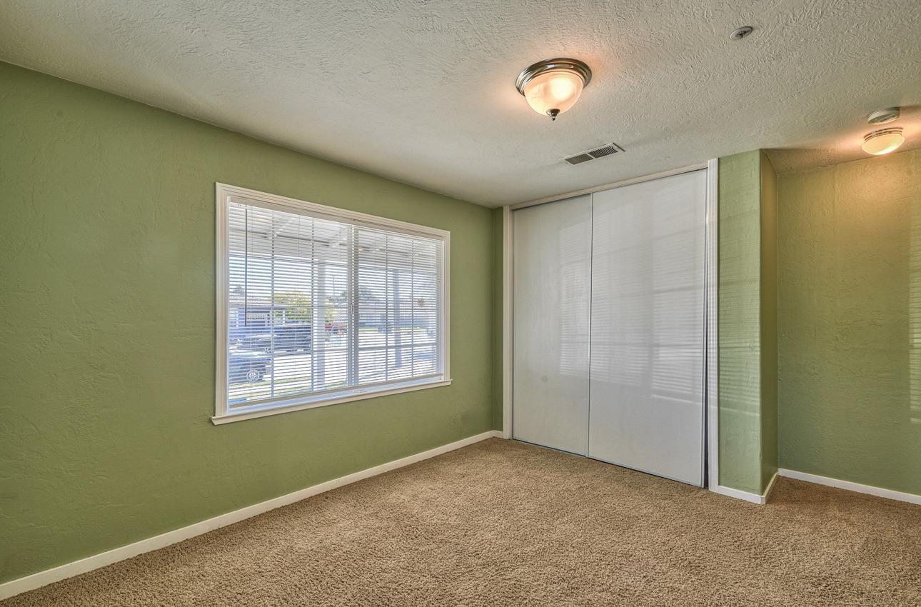 7 Grove Street Salinas, CA 93901 - Photo 25 of 33 an empty room with ceiling fan and window