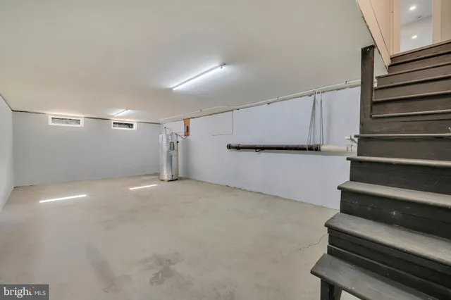 a view of an empty room with stairs