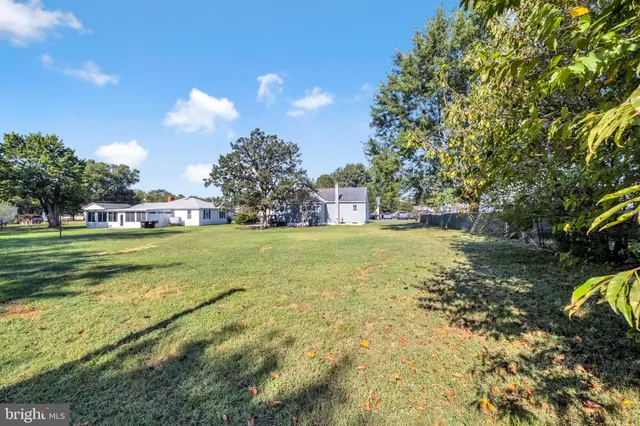 a view of a golf course with a lake view