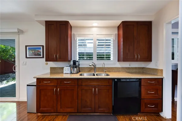a dining room with furniture a rug and wooden floor