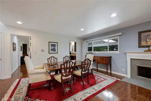 a living room with furniture fireplace and flat screen tv