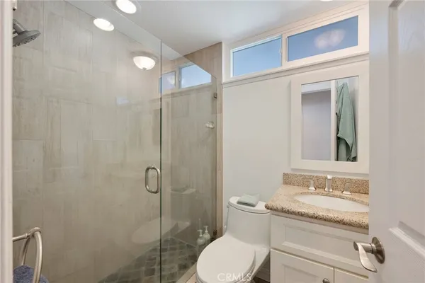 a bedroom with a bed and a chair