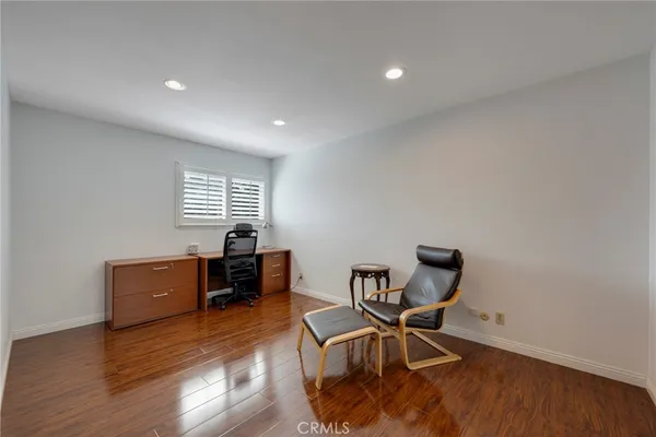 a bathroom with a granite countertop bathtub a sink and a mirror