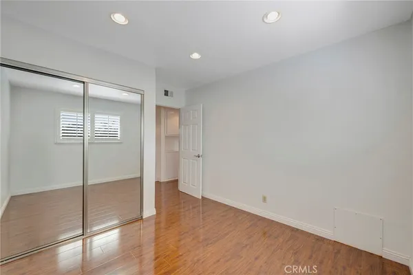 a backyard of a house with barbeque oven table and chairs
