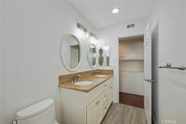 a view of a house with backyard porch and sitting area