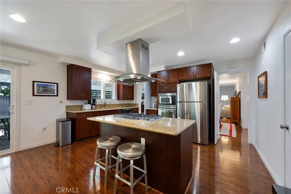 a kitchen with a sink cabinets and stainless steel appliances