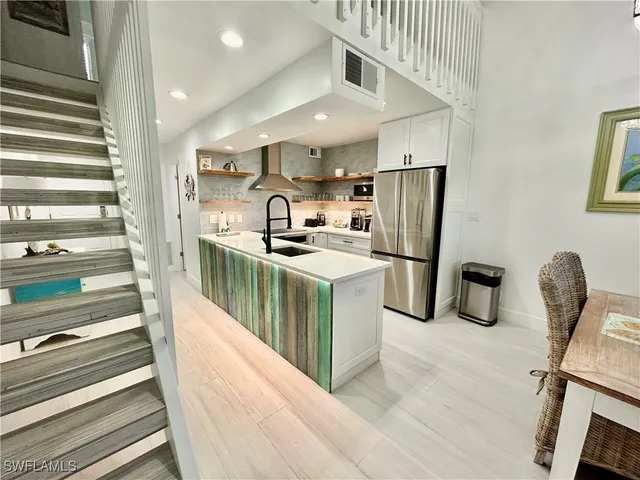 a kitchen with refrigerator and countertop