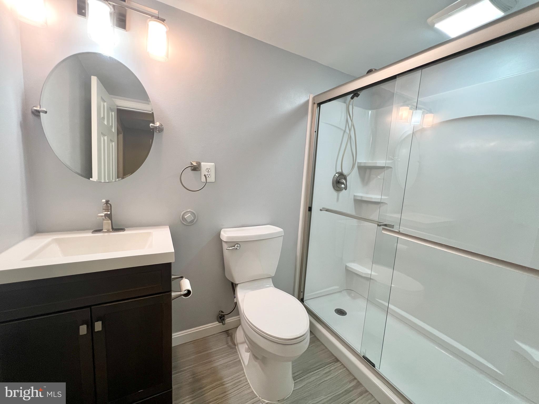10287 Latney Road Fairfax, VA 22032 - Photo 23 of 26 a bathroom with a toilet sink and mirror