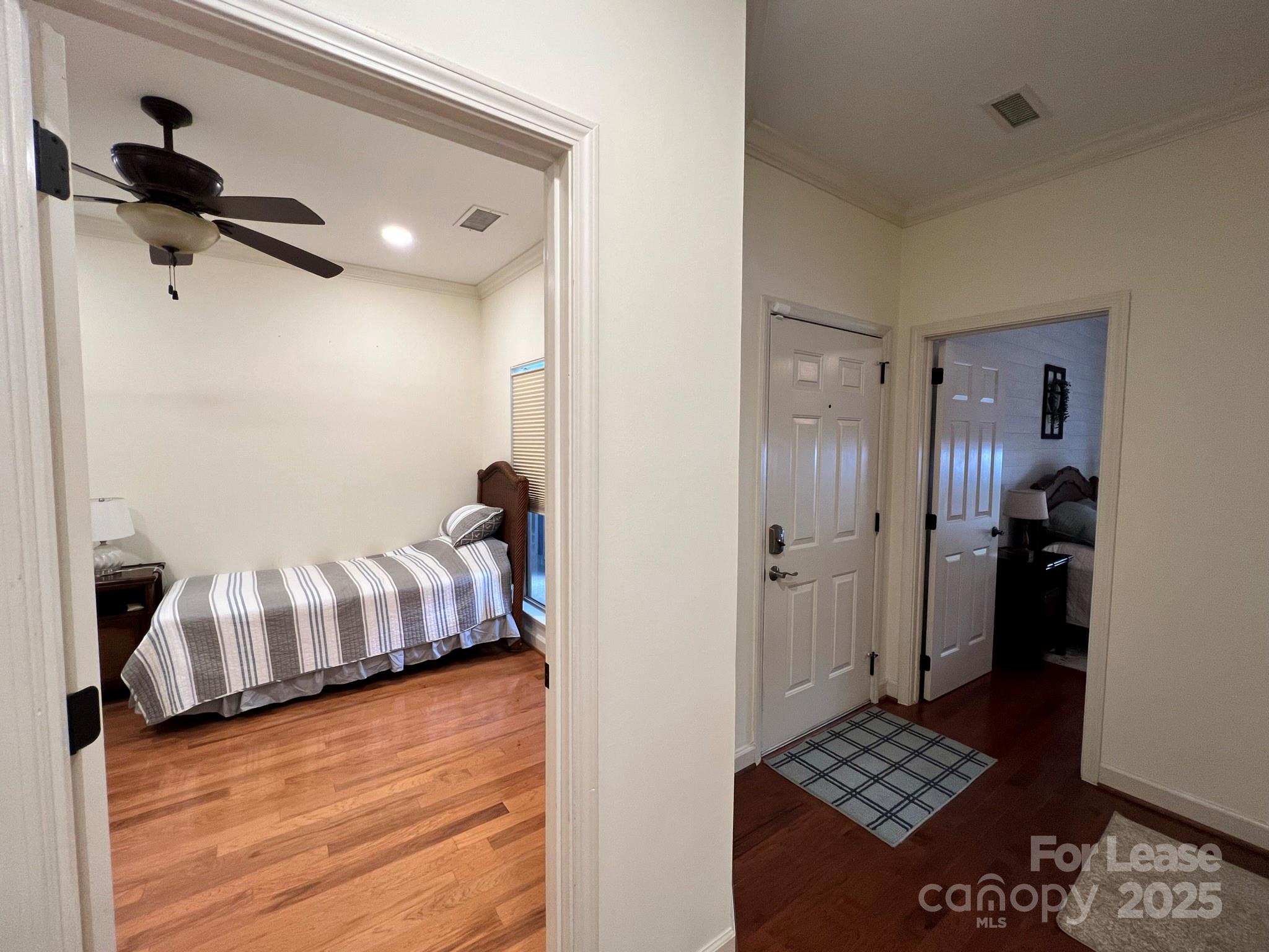 1140 Torrence Circle Davidson, NC 28036 - Photo 11 of 35 a bedroom with a bed and a table