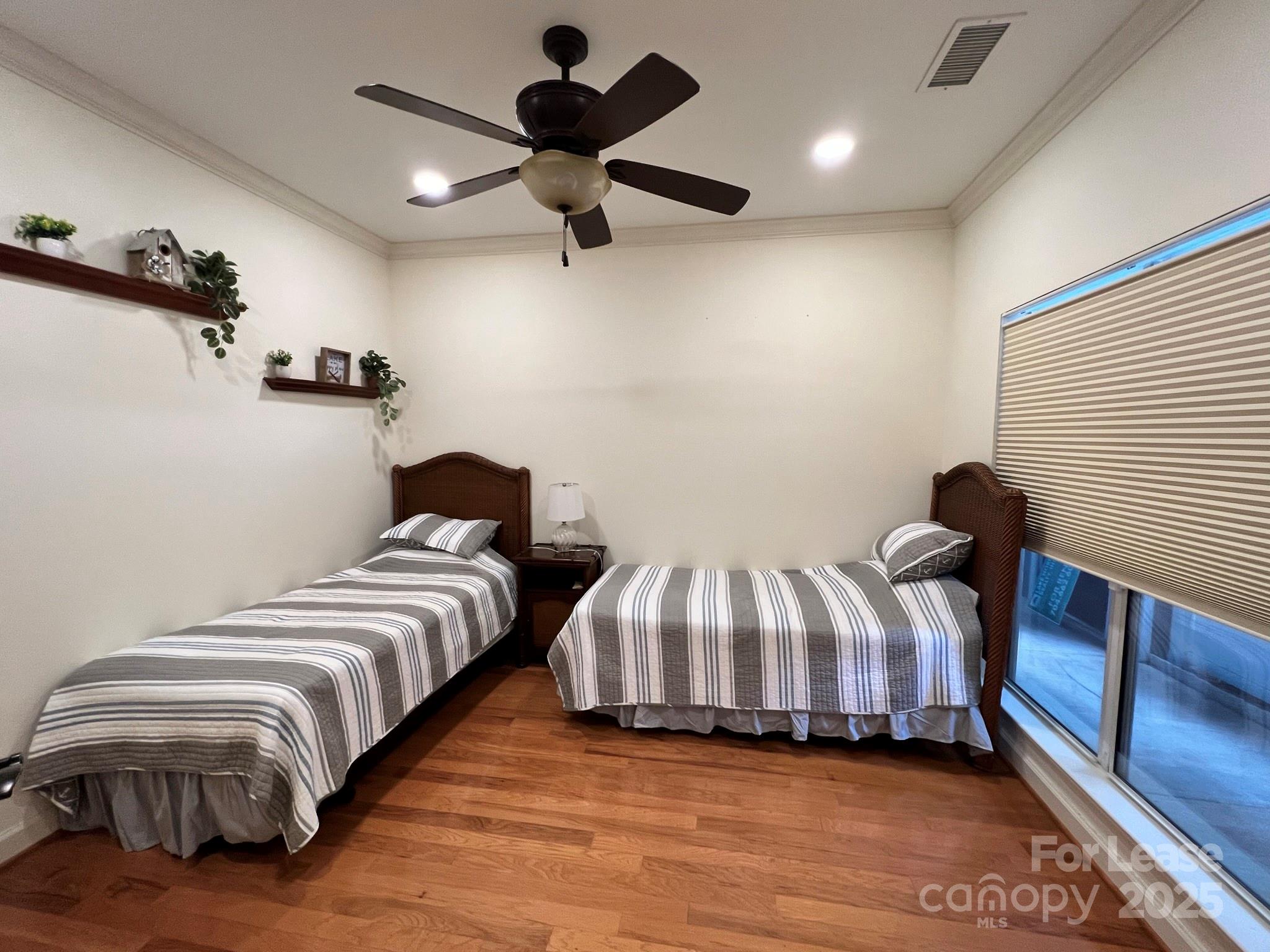1140 Torrence Circle Davidson, NC 28036 - Photo 12 of 35 a bedroom with two beds and painting on the wall