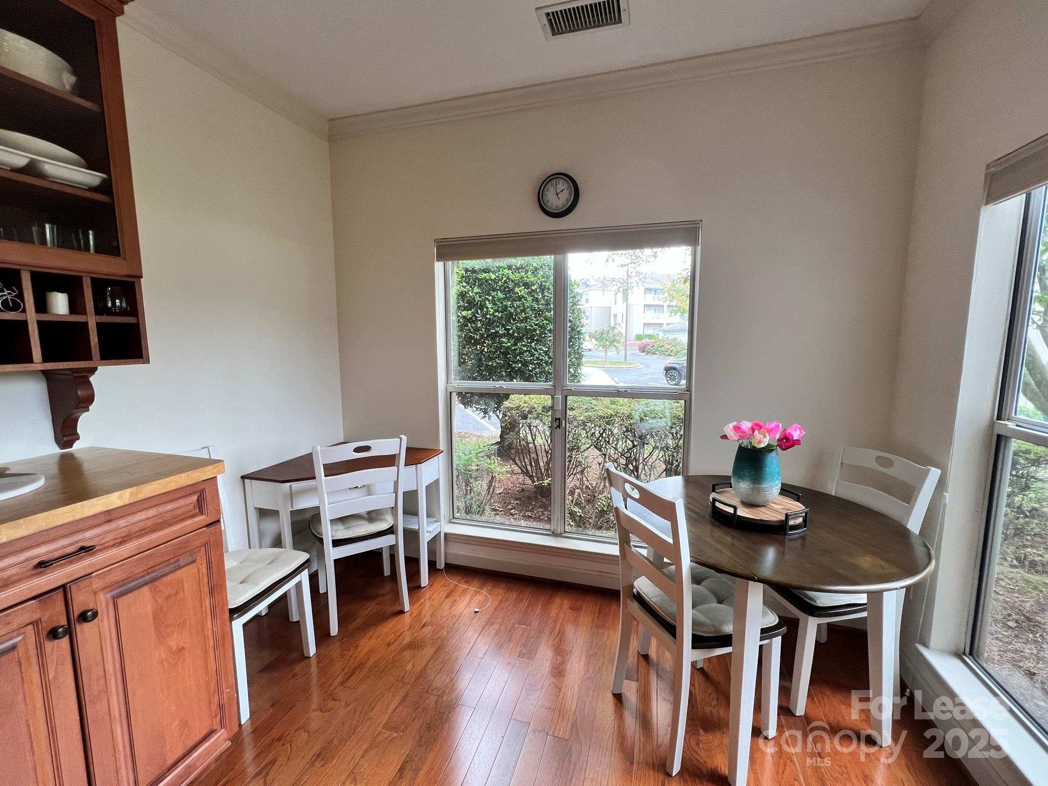 1140 Torrence Circle Davidson, NC 28036 - Photo 16 of 35 a living room with furniture and a wooden floor