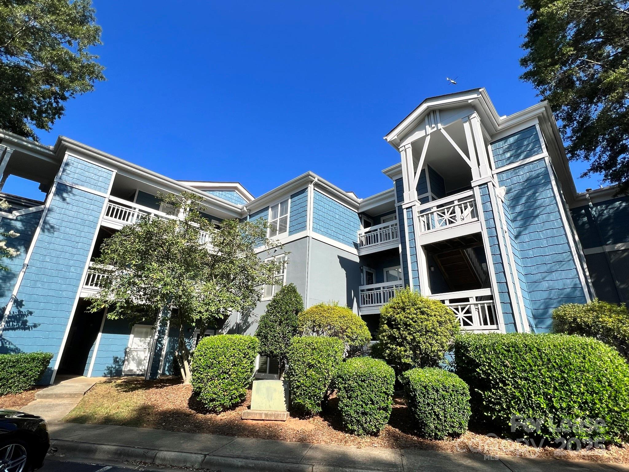 1140 Torrence Circle Davidson, NC 28036 - Photo 2 of 35 a front view of a house with a yard