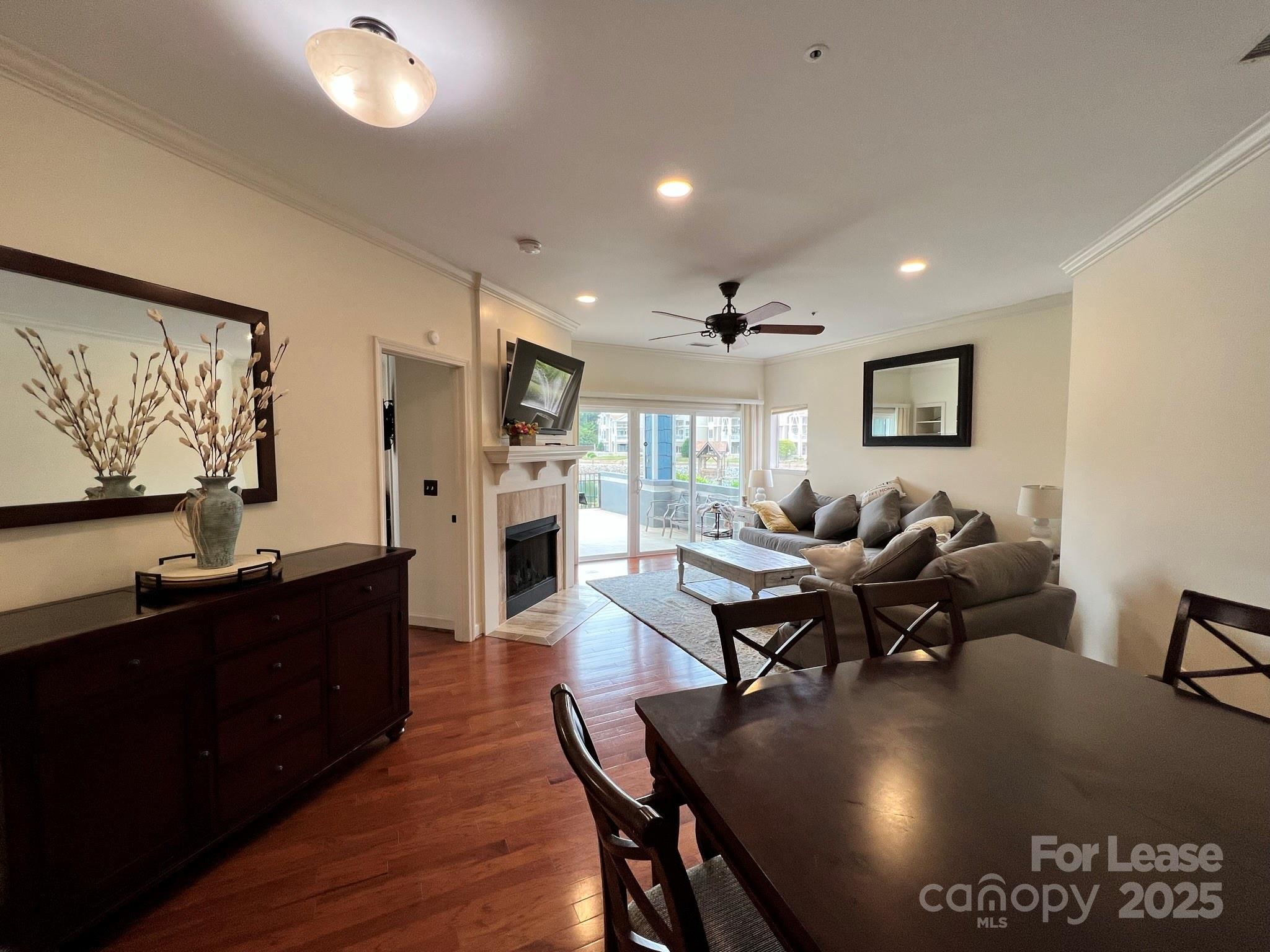 1140 Torrence Circle Davidson, NC 28036 - Photo 21 of 35 a living room with lots of furniture and painting on the wall