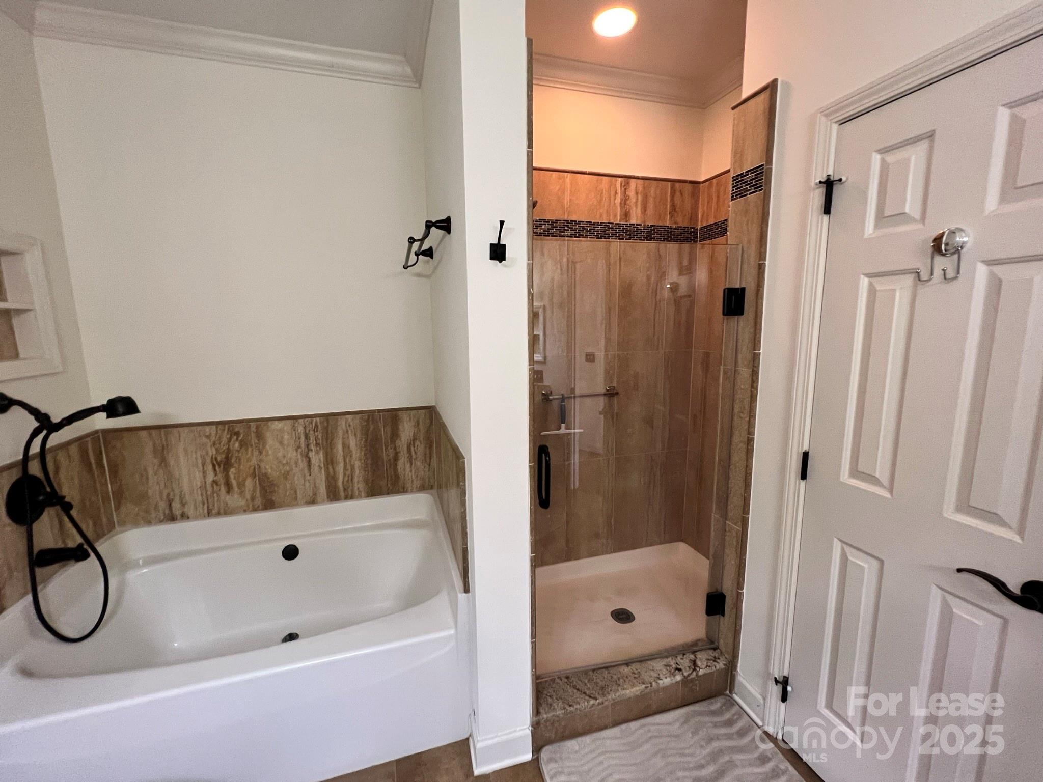 1140 Torrence Circle Davidson, NC 28036 - Photo 29 of 35 a bathroom with a tub and shower