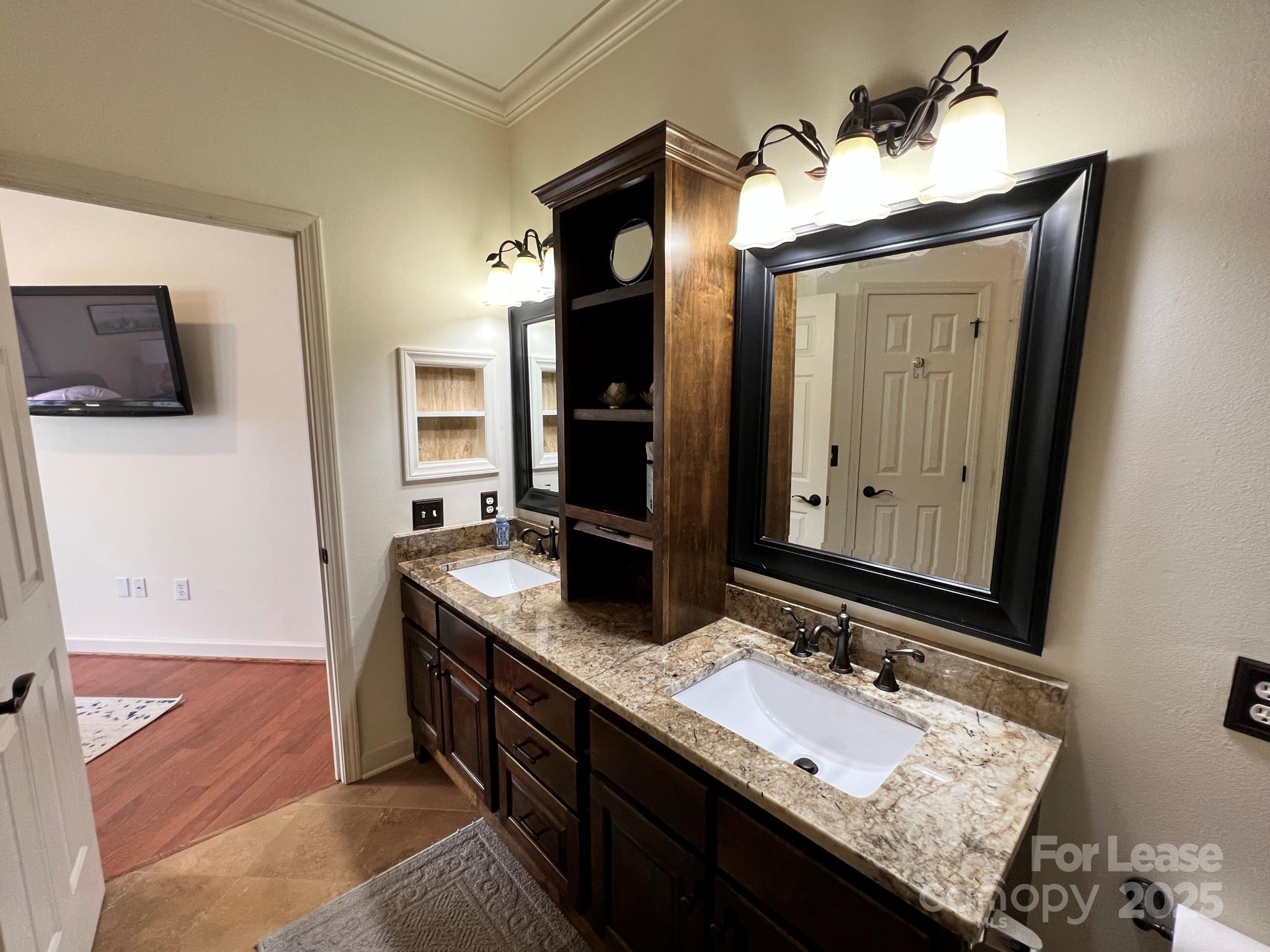 1140 Torrence Circle Davidson, NC 28036 - Photo 30 of 35 a bathroom with a granite countertop double vanity sink and a mirror