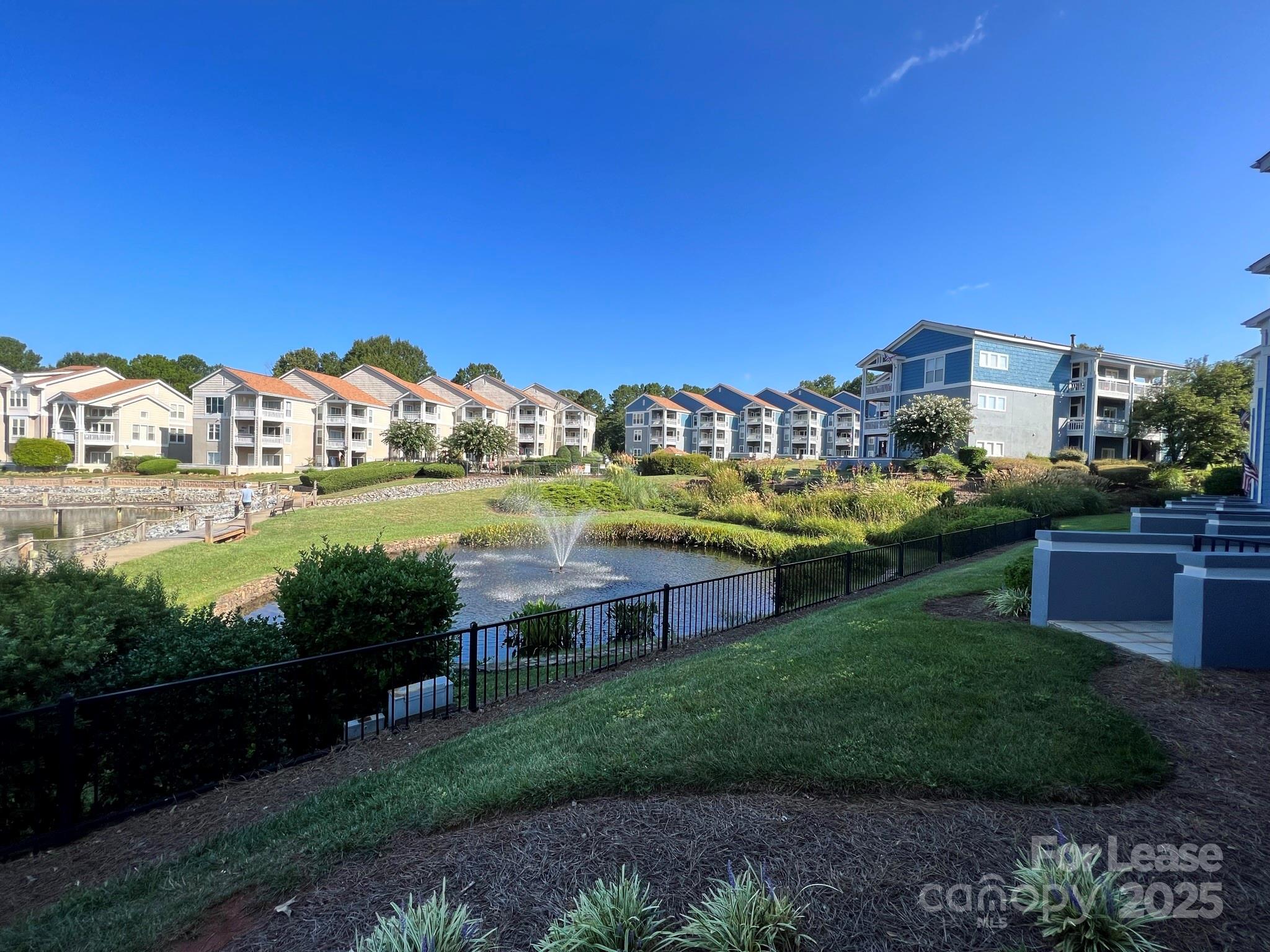 1140 Torrence Circle Davidson, NC 28036 - Photo 34 of 35 a view of a city with lawn chairs