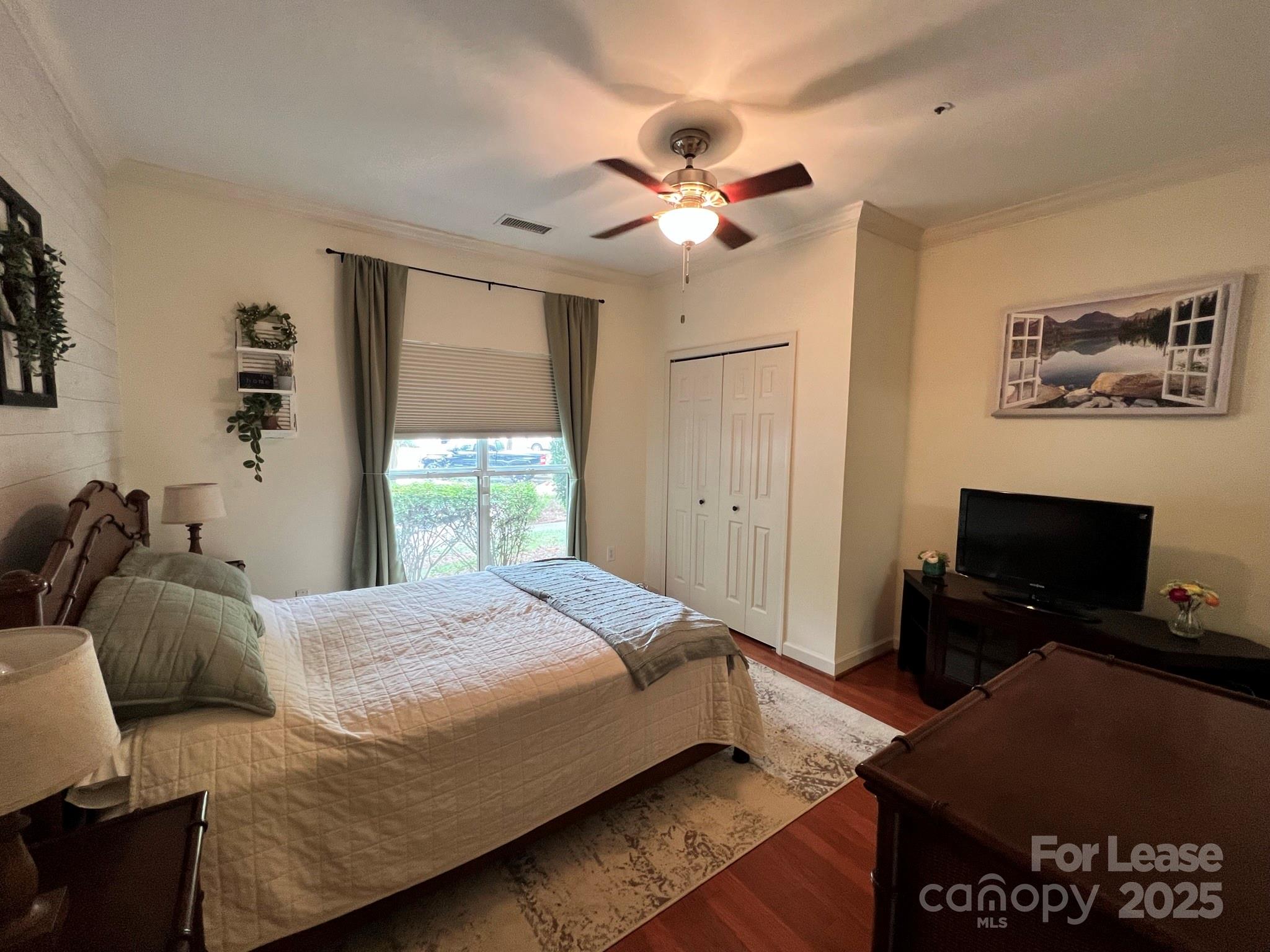 1140 Torrence Circle Davidson, NC 28036 - Photo 5 of 35 a bedroom with a bed and a window