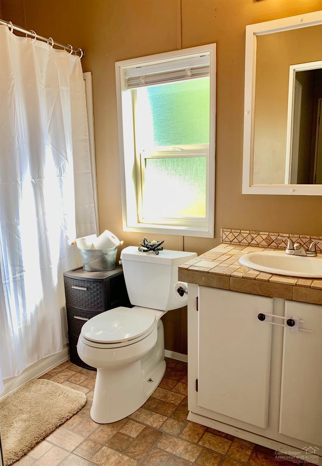 703 Center Ridge Drive Culver, OR 97734 - Photo 21 of 22 Guest bathroom has tub/shower combo &