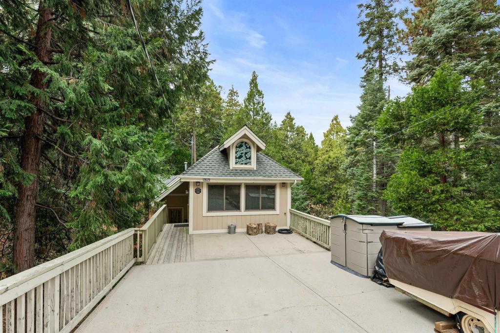 26328 Jacqueline Road Twin Peaks, CA 92391 - Photo 1 of 37 a front view of a house with a yard