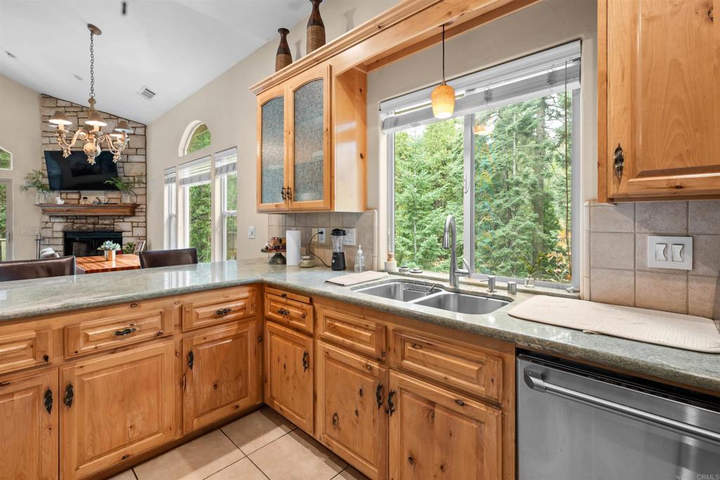 26328 Jacqueline Road Twin Peaks, CA 92391 - Photo 11 of 37 a kitchen with a sink window and cabinets