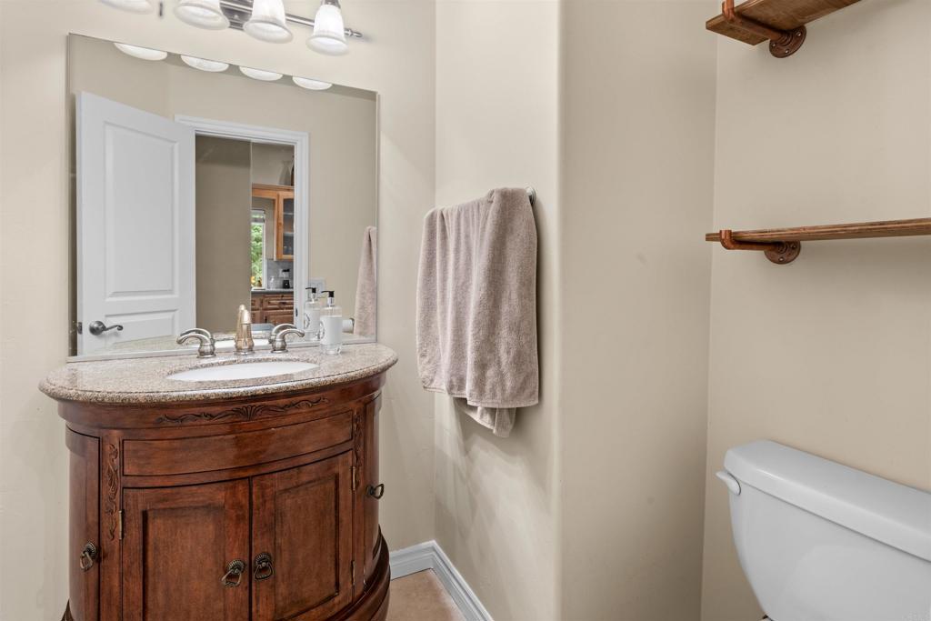 26328 Jacqueline Road Twin Peaks, CA 92391 - Photo 13 of 37 a bathroom with a sink a toilet and a mirror
