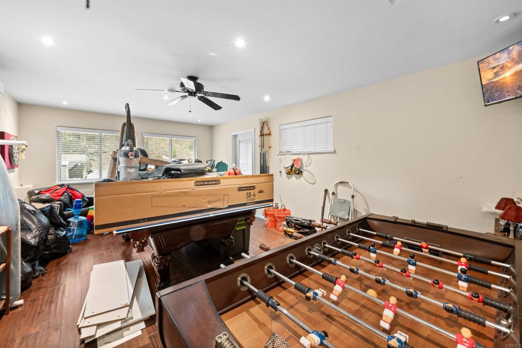 26328 Jacqueline Road Twin Peaks, CA 92391 - Photo 14 of 37 a room with gym equipment and wooden floor