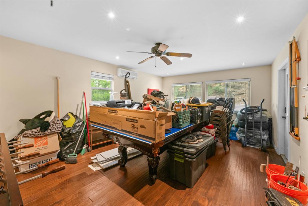26328 Jacqueline Road Twin Peaks, CA 92391 - Photo 15 of 37 a room with gym equipment and wooden floor