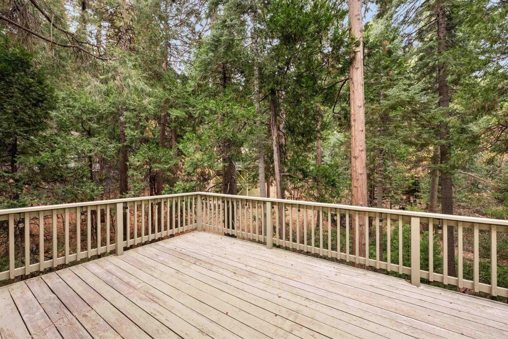 26328 Jacqueline Road Twin Peaks, CA 92391 - Photo 16 of 37 a balcony with wooden floor and fence