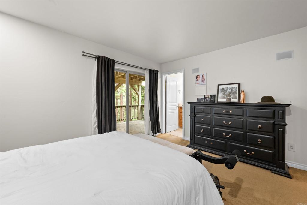 26328 Jacqueline Road Twin Peaks, CA 92391 - Photo 22 of 37 a bedroom with a bed and a dresser
