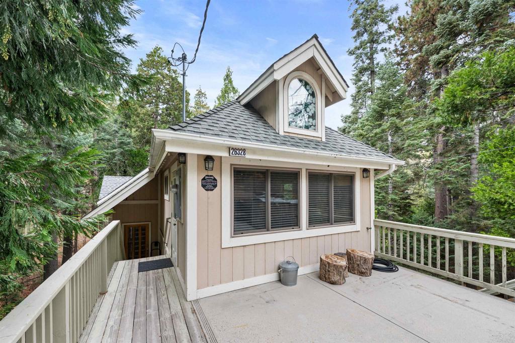 26328 Jacqueline Road Twin Peaks, CA 92391 - Photo 3 of 37 a front view of a house with a porch