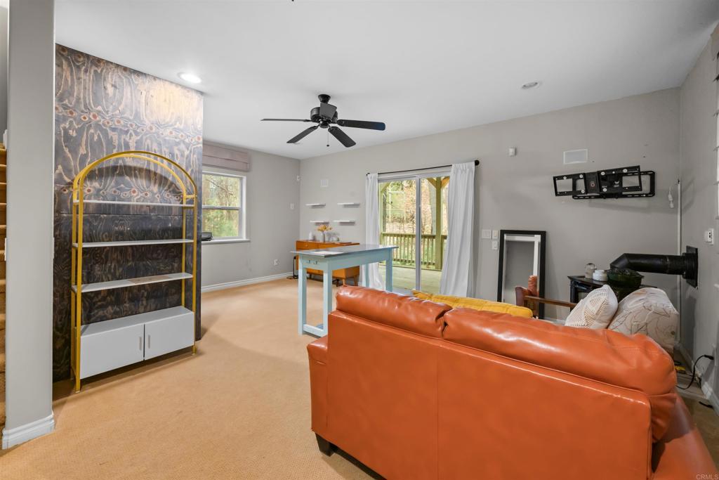 26328 Jacqueline Road Twin Peaks, CA 92391 - Photo 35 of 37 a living room with furniture and a flat screen tv