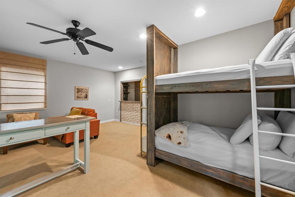 26328 Jacqueline Road Twin Peaks, CA 92391 - Photo 36 of 37 a bedroom with a bed and a chandelier