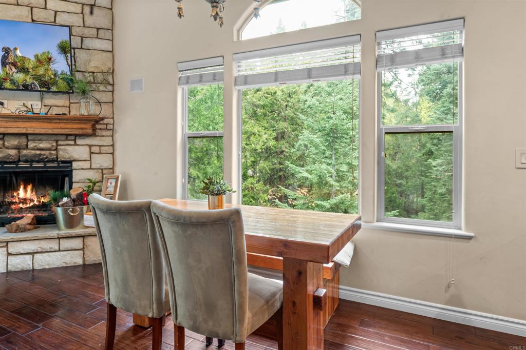 26328 Jacqueline Road Twin Peaks, CA 92391 - Photo 6 of 37 a view of a dining room with furniture window and wooden floor