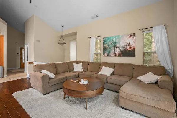 a living room with furniture and a large window