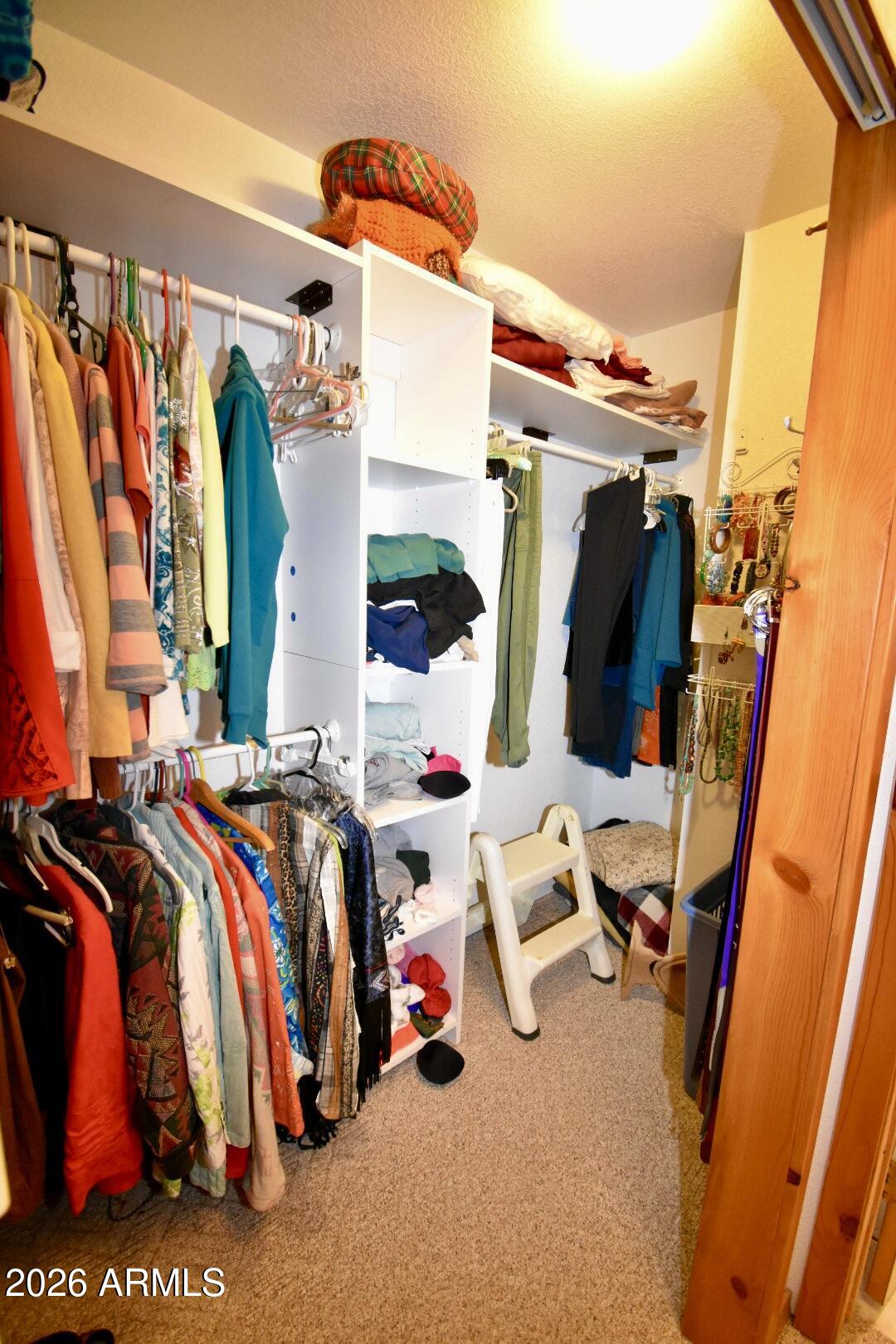 4310 North Lake View Drive Rimrock, AZ 86335 - Photo 16 of 43 a view of walk in closet with clothes and shoes